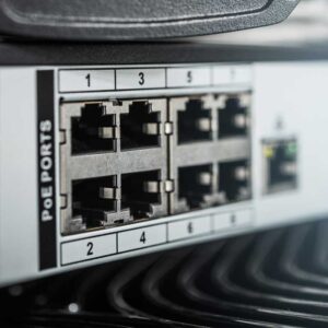 PoE ports on a KVM over IP console with Ethernet cables plugged in.